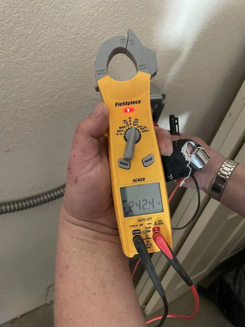 Voltage testing with clamp meter during Outlet Installation in Frostburg